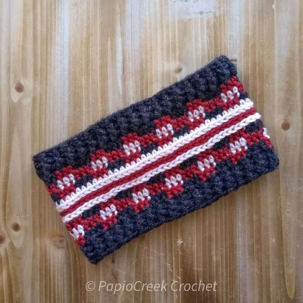 red, pink, dark grey stripey plaid crochet ear warmer